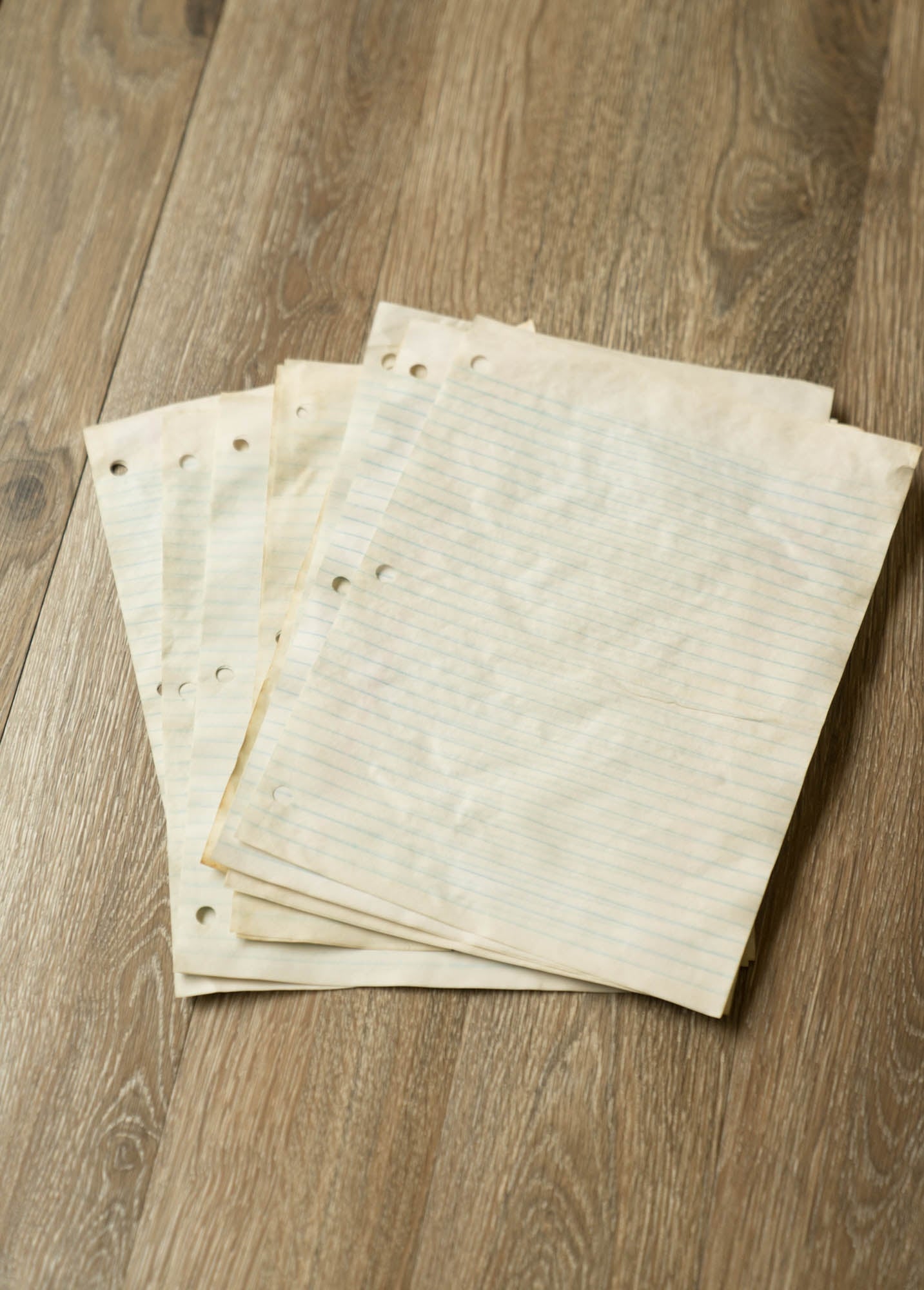 Coffee Dyed Lined Ruler Pages Flat Lay on a wooden table