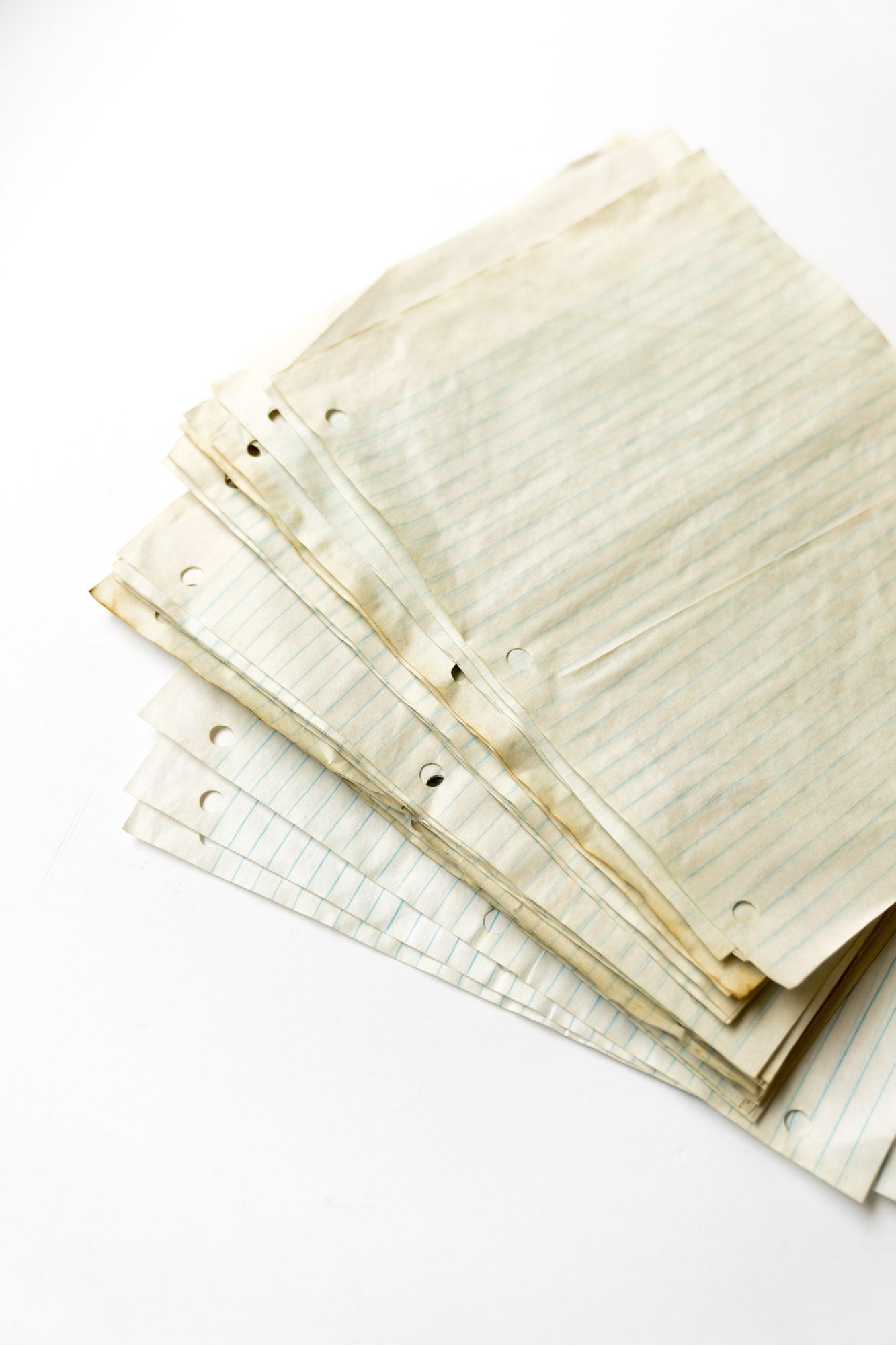 Coffee Dyed Lined Ruler Pages Flat Lay on White Table